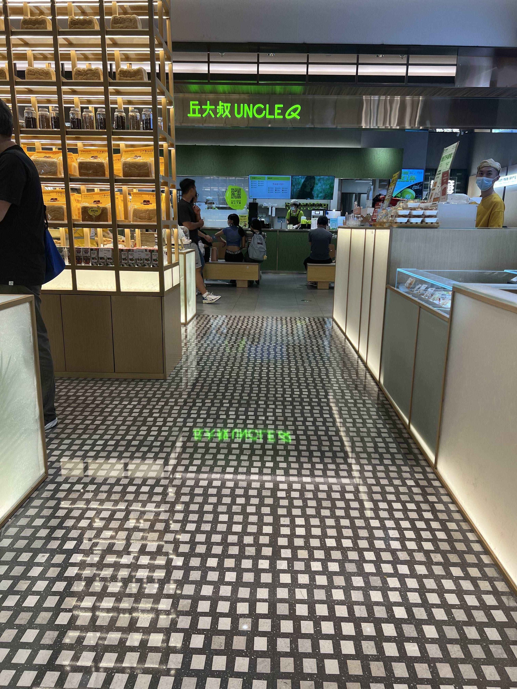 Gray base color terrazzo with white marble aggregate for the floor of shopping mall cake shop