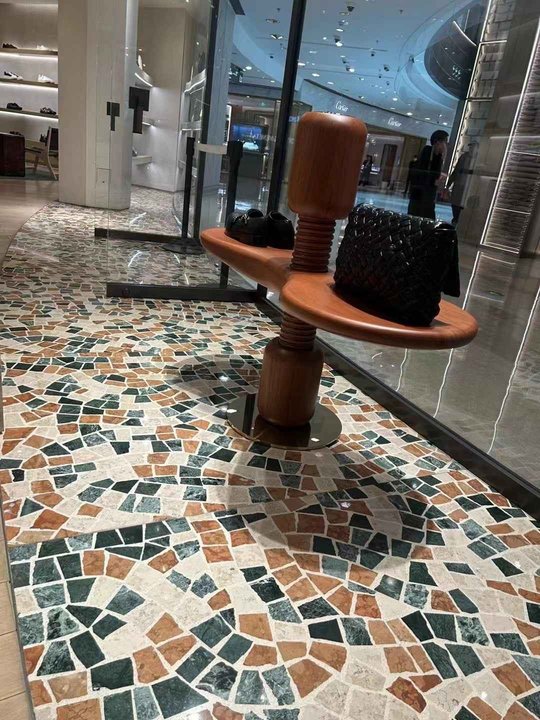 The interior floor of the trendy bag store is fully paved with colorful marble terrazzo