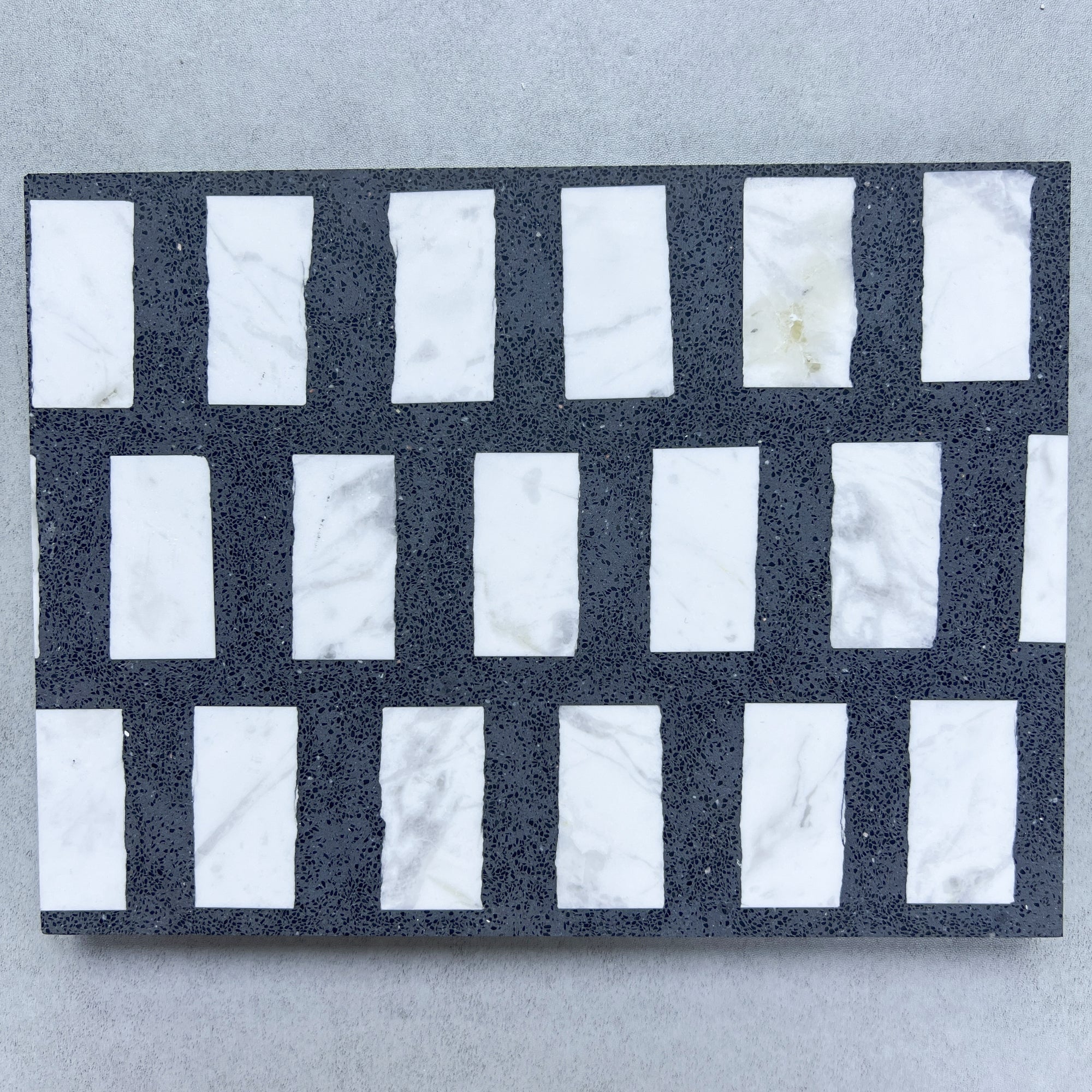 White marble terrazzo with black fine sand