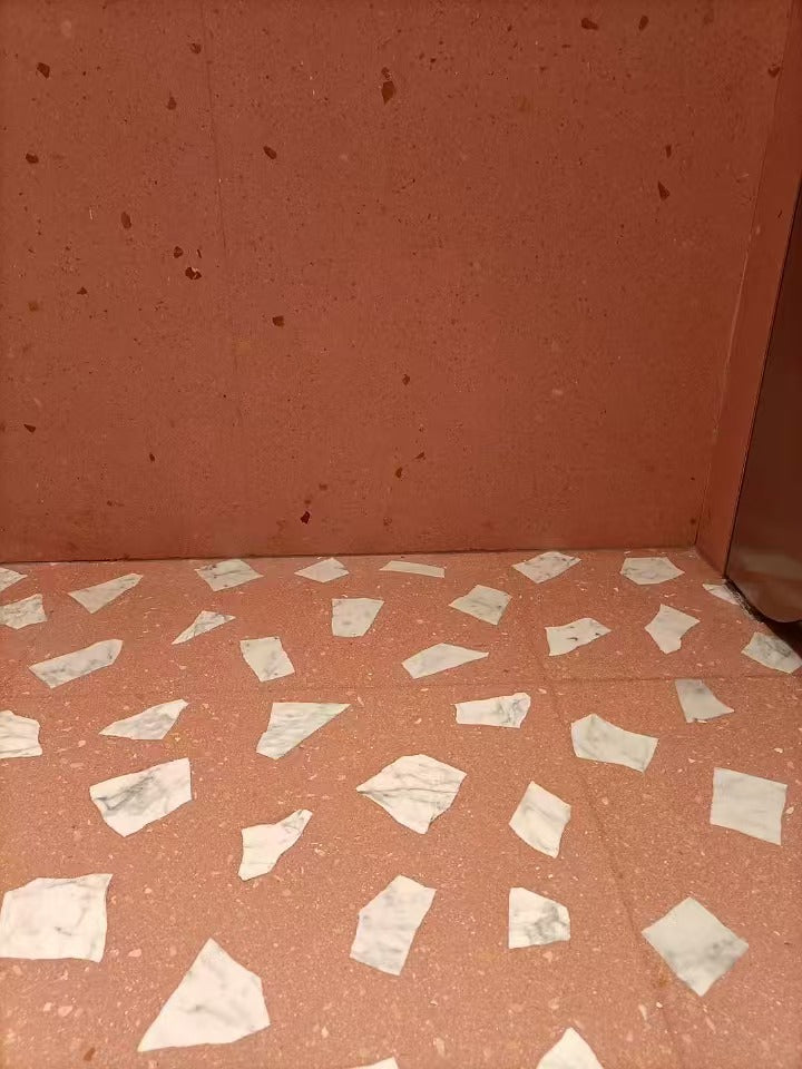 White marble terrazzo on the floor of the shopping mall public toilet