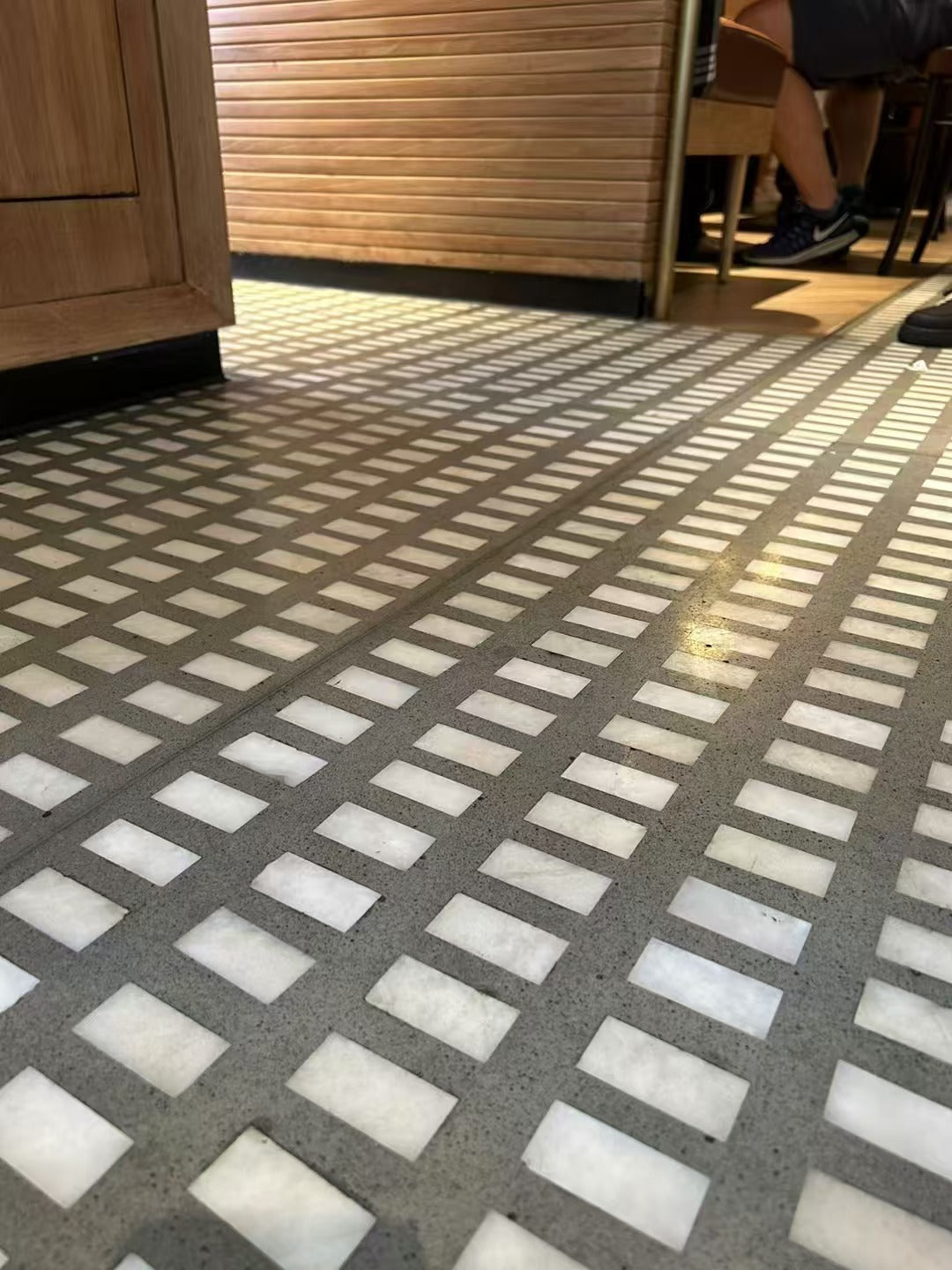White large-grain terrazzo on the floor of a restaurant