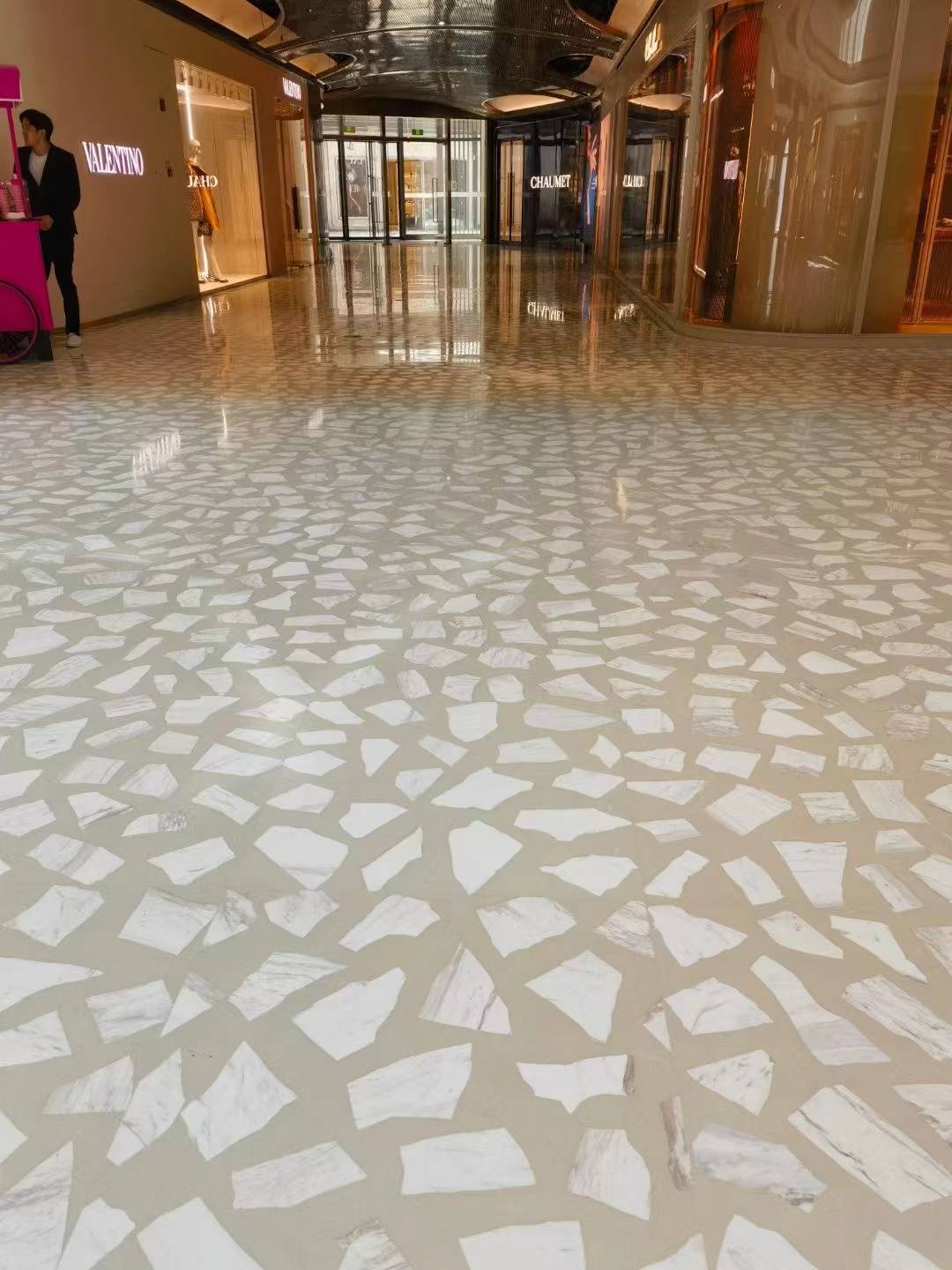 White marble irregular terrazzo used on the floor of the shopping mall